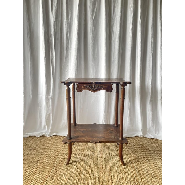 A very beautiful Art Nouveau style pedestal table, early 20th century. Made entirely of turned walnut, it comprises two...