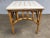 Vintage Pole Rattan Center Coffee Table featuring an arched base with a square patterned solid resin top. 1980, United...