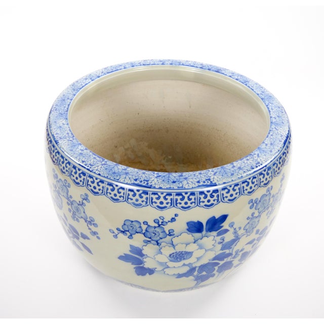 This elegant Asian blue-and-white porcelain vessel, dating to the late 20th century, features a generously proportioned...
