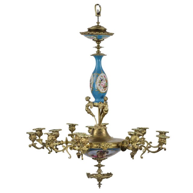Chandelier for 15 candles, made in the Louis XVI style, decorated with gilded relief decoration in the form of foliage and...