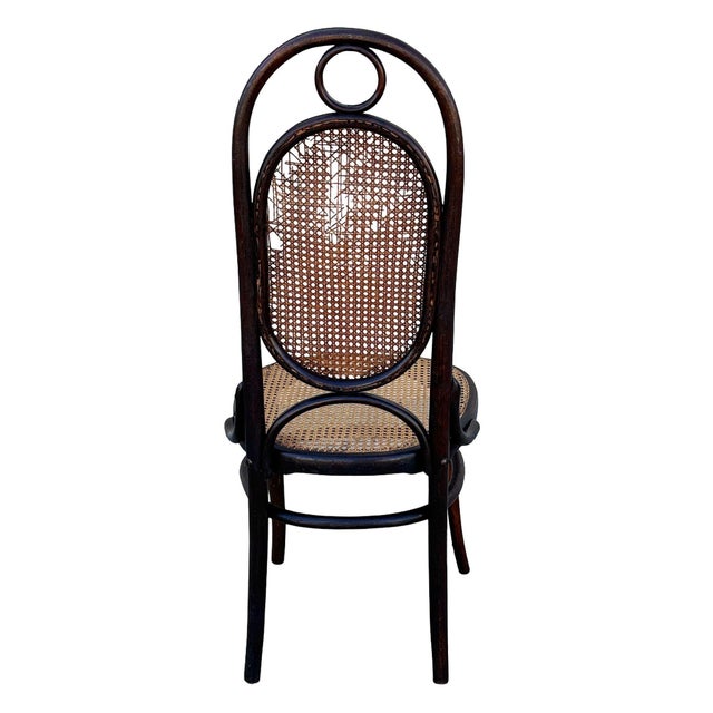 Victorian high back Thonet number 17 side chair featuring an elegant, sculptural frame crafted from warm-toned bentwood...
