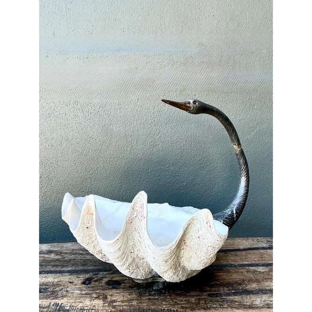 This vintage monumental swan centerpiece is a dramatic fusion of sculptural metalwork and natural clam shell, striking a...