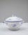 This 20th Century French special edition porcelain tureen features an elegant rounded form elevated on a flared pedestal...