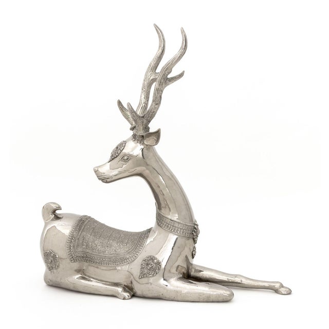 Thai Recumbent Deer Nickel Plate Sculpture. 31.75" H x 20.5" W x 6" D. Provenance: From a 422 East 72nd Street Estate.