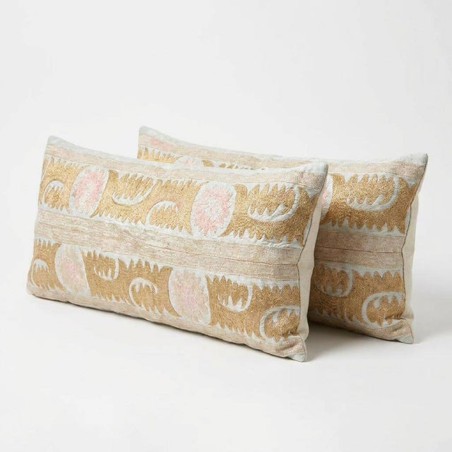 This beautiful 17'' x 48'' hand-embroidered Suzani pillow cover set was made from authentic Uzbek cotton fabric. The...
