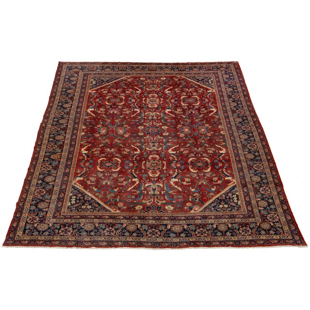 19th-century antique Mahal Persian Handmade Wool Rug with red field and multicolor floral Design. This rug measures 10' x...