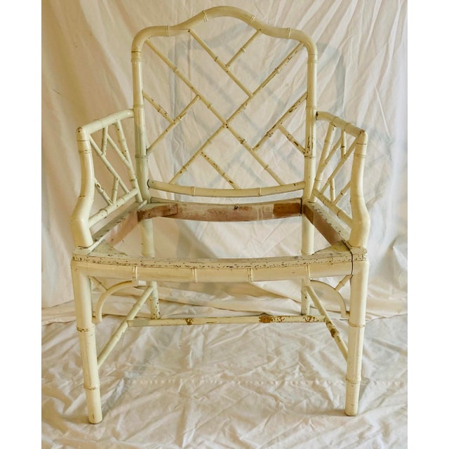 Classic Faux bamboo Chinese chippendale style dining arm chair in need of lo e paint and upholstery.