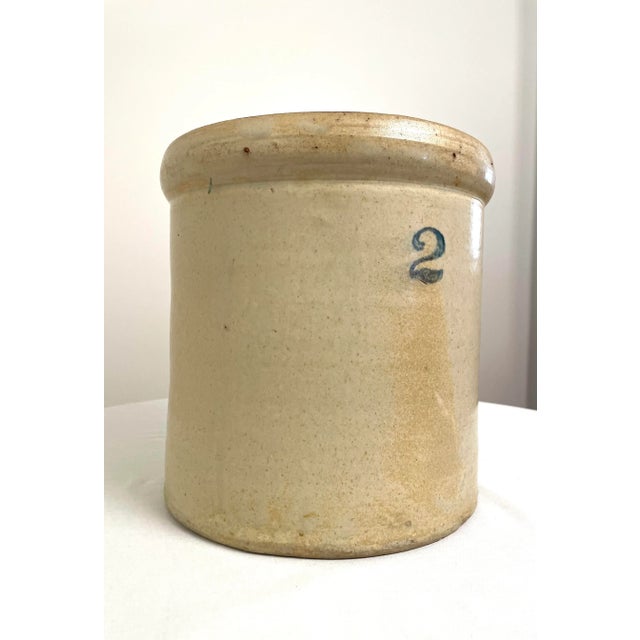 This Early American antique salt-glazed crock once used for general utilitarian kitchen use is now a standout decor piece...