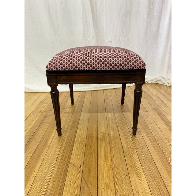 Vintage Georgian style vanity bench featuring elegant tapered legs, carved details, and a rich mahogany-stained wood...