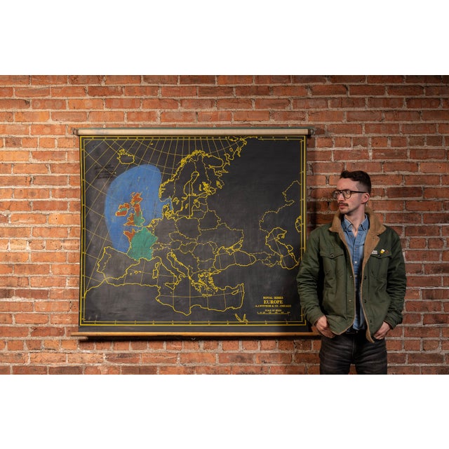 Mid-20th-century pull-down classroom map of Europe from A.J. Nystrom & Co.'s Royal Series, featuring a dramatic black...