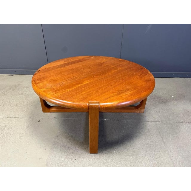 Mid century solid teak coffee table attributed to Niels Bach. beautiful round table top with an interlocking base. Very...