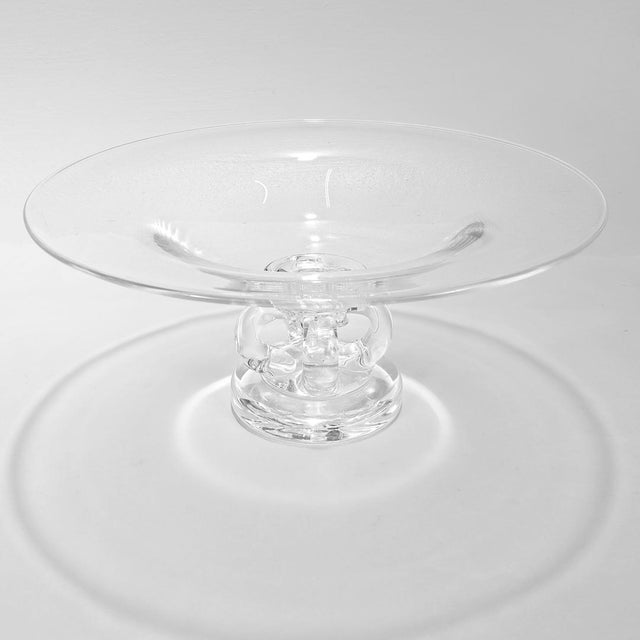 A fine Mid-Century glass pedestal bowl or tazza. By Steuben. Model no. 7884. Designed by George Thompson. With a wide...