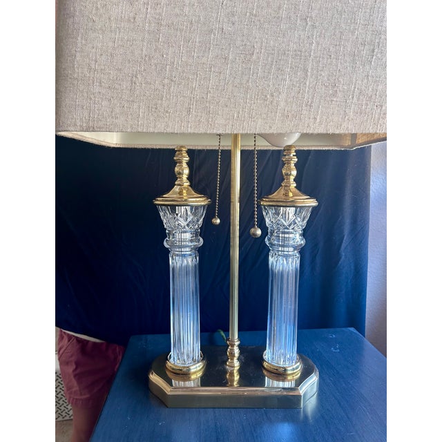 Late 20th-century Neoclassical double column table lamp by the world-renowned makers at Waterford Crystal. This...