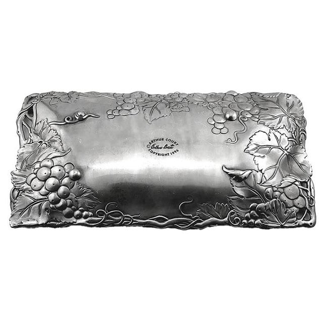 Vintage Arthur Court rectangular aluminum serving dish with small round ball feet. Signed on bottom, light surface scratches.