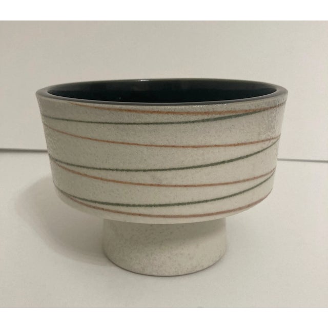 Modern design Ikebana vase used in Japan for flower arranging or plants. Glazed ivory ground with olive and siena swirl...