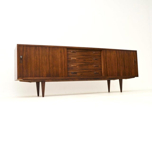 A stylish and extremely well made Danish vintage sideboard by Clausen and Son. This was made in Denmark, it dates from the...