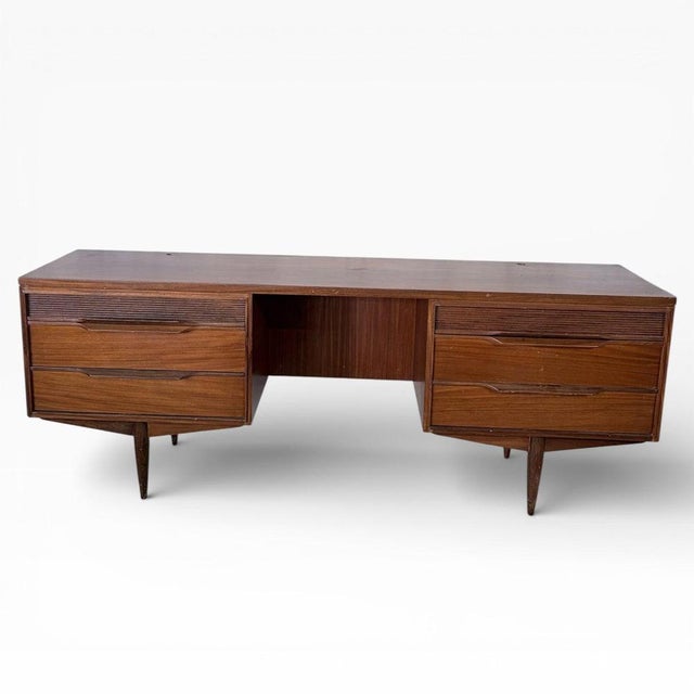 A well-proportioned mid-century teak desk by White & Newton , showcasing the clean lines and practical elegance the maker...