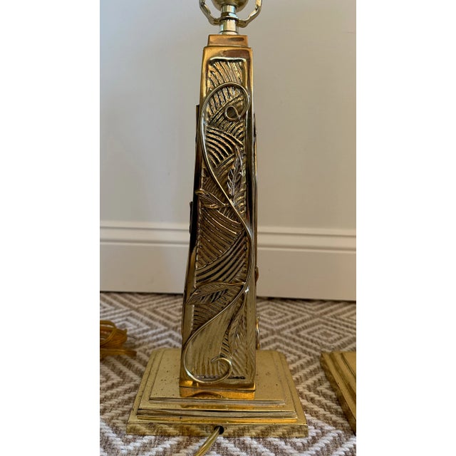 Fabulous pair of rare and unique vintage solid brass lamps with scroll and leaf detail on each side that could work in a...