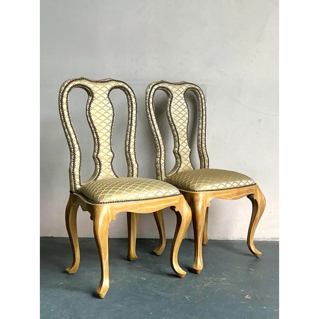 Presenting an elegant pair of Vintage Regency Nailhead Queen Anne Dining Chairs, exuding classic sophistication and...