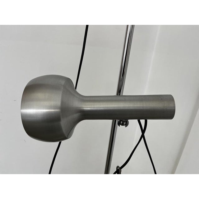 A floor lamp in classic Space Age design, dating from the 1960s, likely made in Italy. The exceptionally high-quality...
