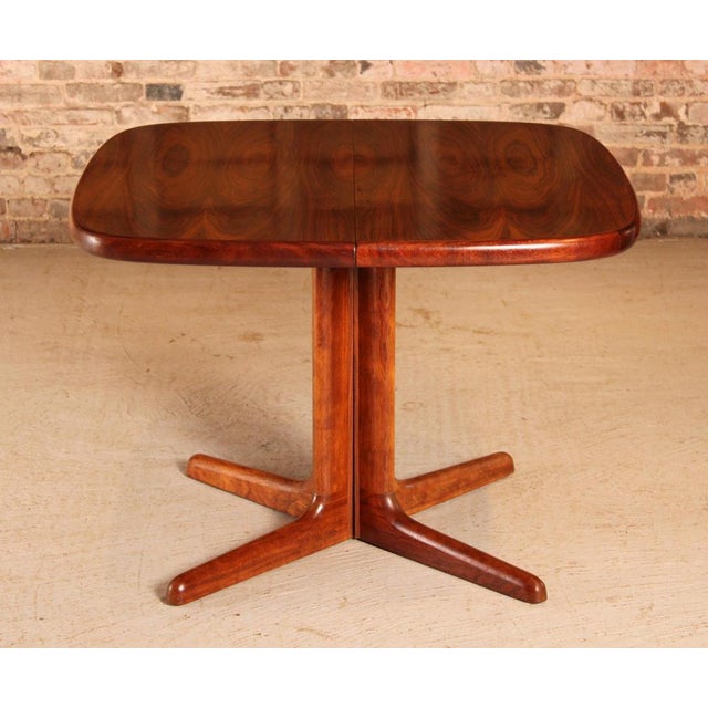 Danish Mid Century extending rosewood dining table by Skovby, circa 1970s. Can be extended with 2 extension leaves to...