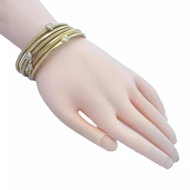 These beautiful bangles are by David Yurman from his Classic Cable Collection. They are a set of 6 bangles crafted from...