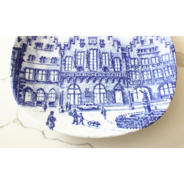 Decorative porcelain plate featuring Scenic illustration Römer square in Frankfurt Germany. The blue ship logo verso...