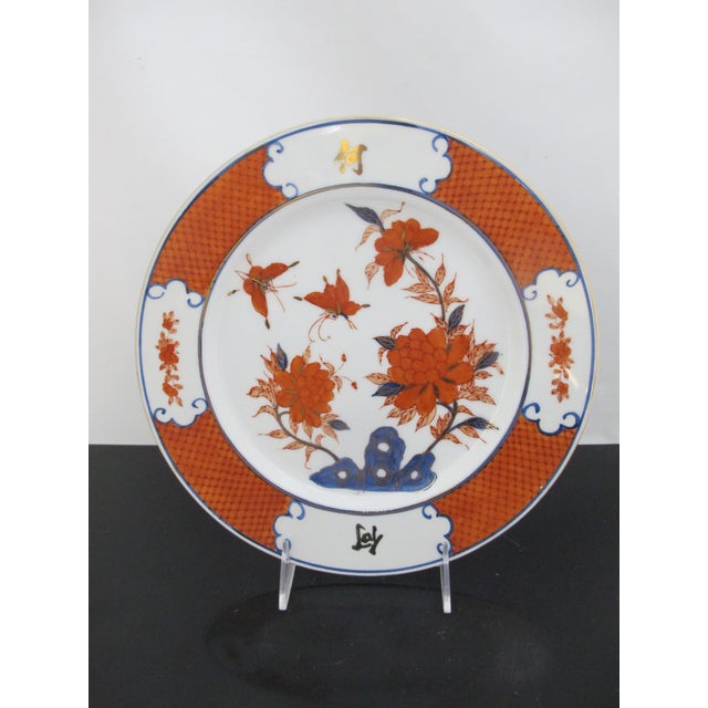 Really beautiful pair of Japanese Imari dinner plates. White porcelain, each with hand painted floral and butterfly...