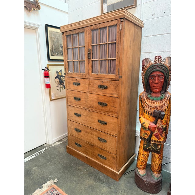 An exceptionally functional and highly charming stripped pine gentleman's chifferobe wardrobe chest. This multi-functional...