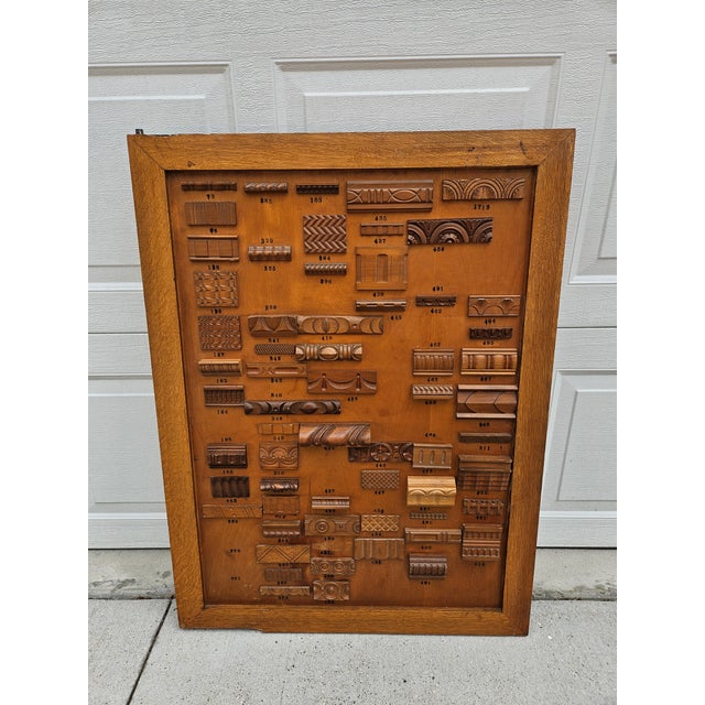 Antique mercantile double-sided display of various wood trim, molding or wooden appliques. This panel is sure to catch the...