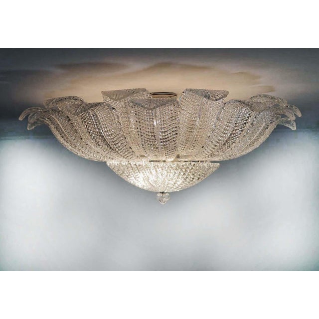 DUTIES INCLUDED Stunning Murano ceiling lamp, 1970s style, with 24 hand-blown, leaf-shaped clear glass panels forming a...