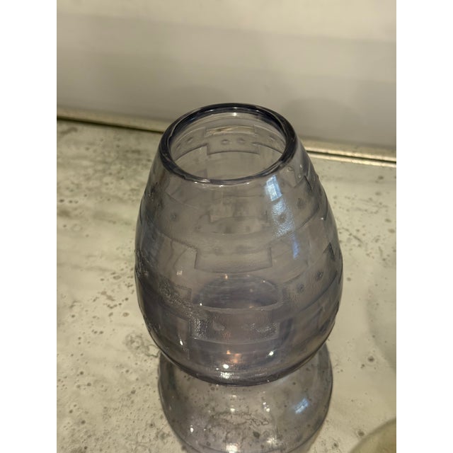 Unsigned vintage art glass vase in smoky lavender-gray glass, with raised, rough-textured geometric bands around a softly...