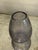 Unsigned vintage art glass vase in smoky lavender-gray glass, with raised, rough-textured geometric bands around a softly...