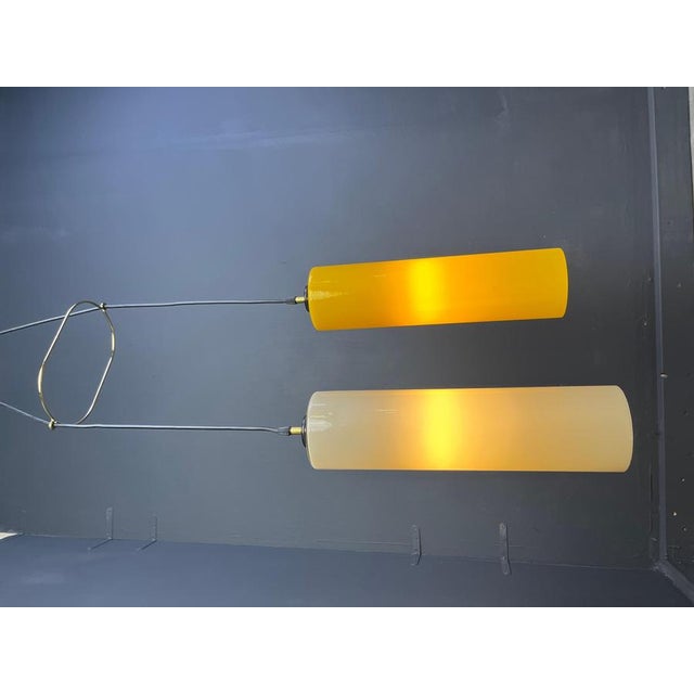 Large vintage yellow and beige glass pendant lights by Vistosi. This chandelier or pendant lights are made out of italian...