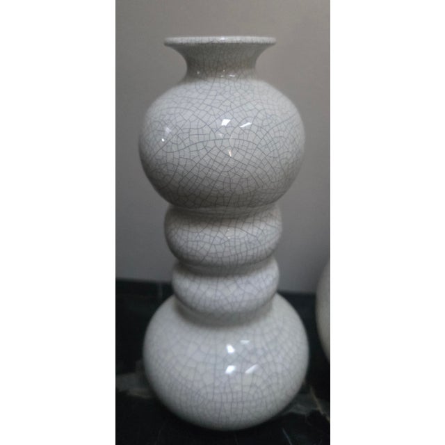 Beautiful trio of mid-century white crackle-glazed ceramic vases, showcasing a distinct multi-bulbed "gourd" or "totem"...