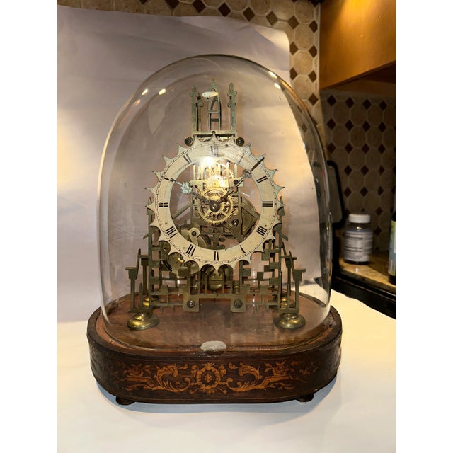 This listing is for an antique skeleton clock. The clock is English and dates to the 19th century. The clock was made in...