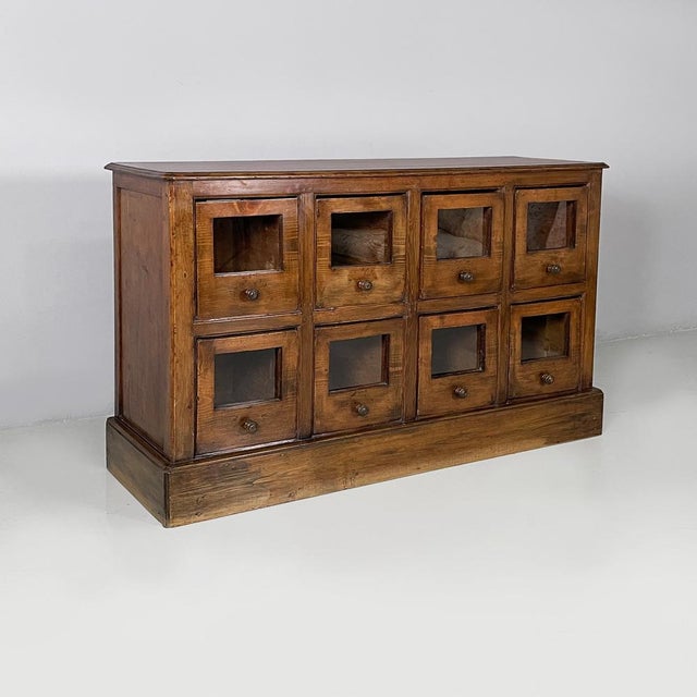 Italian Art Deco chest of drawers in wood and glass, 1930s Rectangular chest of drawers with eight drawers. Each drawer...