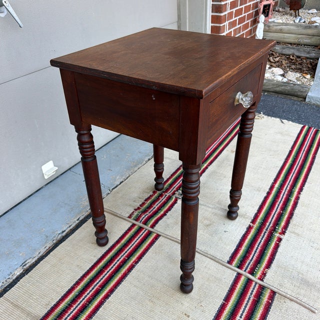 Antique Walnut Sheraton One Drawer Stand, Lebanon County, Pennsylvania, Circa 1830s A supremely satisfying and regionally...