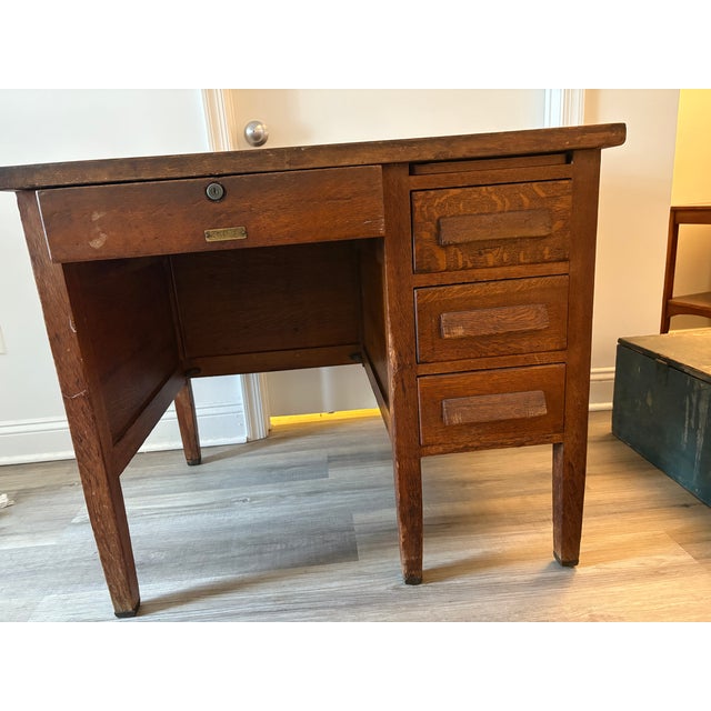 Antique small oak desk from the Derby Desk Company, early 1900s.