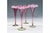 A matched set of four Victorian cranberry opal glass trumpet vases, circa 1890, hollow stemmed with crimped rims with a...