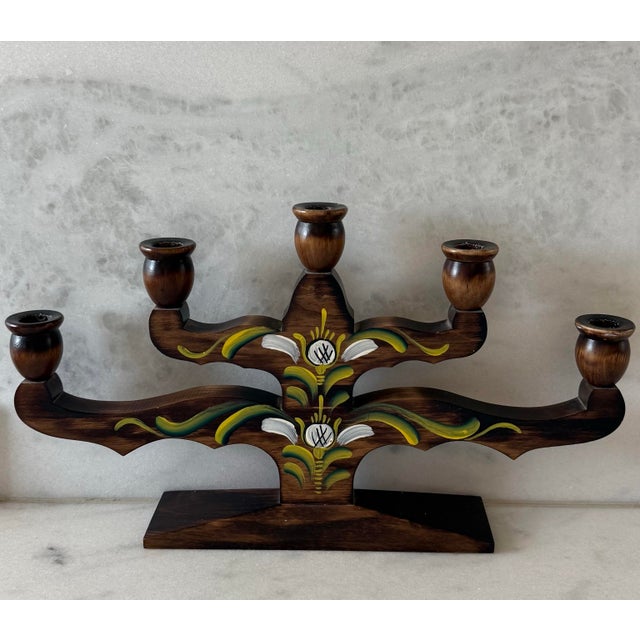 Vintage Scandinavian hand painted wooden candelabra with 5 arms. Crafted in Sweden and featuring a beautiful and simple...