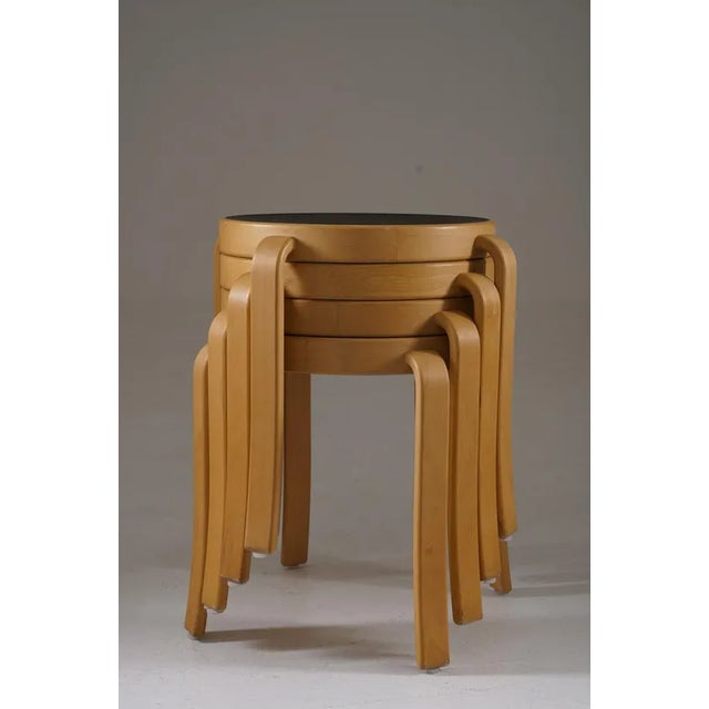 These are 8000 Series Stools designed by Rud Thygesen and Johnny Sørensen, showcasing a minimalist Scandinavian aesthetic....