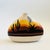 A vintage Southwestern pottery vase. Flat oval shape with hand painted scenery of the sides. Measures 6.5"W x 2.25"D x 5"H