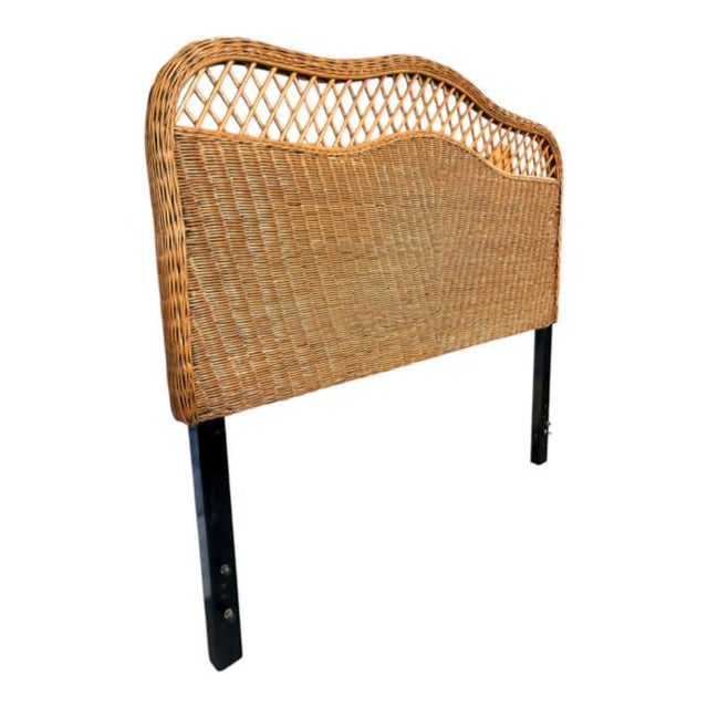 Elegant vintage Safavieh wicker headboard, measuring 57" wide, designed for a Full/Double-size bed. It features a...
