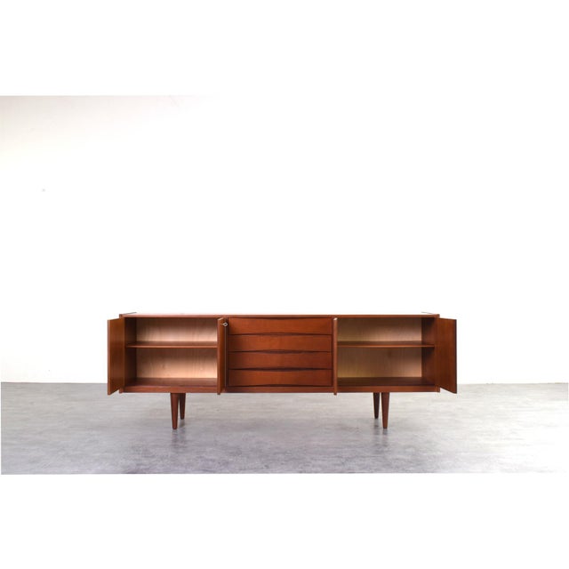 This teak sideboard from the 1960s was made by Skeie & Co. Norheimsund and it is an example of design that combines...