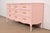 A gorgeous French Provincial Louis XV style nine-drawer triple dresser or credenza By Henredon USA, Circa 1960s Pink...