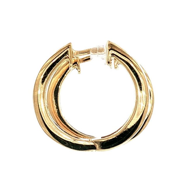 A pair of late 20th-century diamond hoop earrings crafted from 14k gold. The design features a row of 12 channel-set...