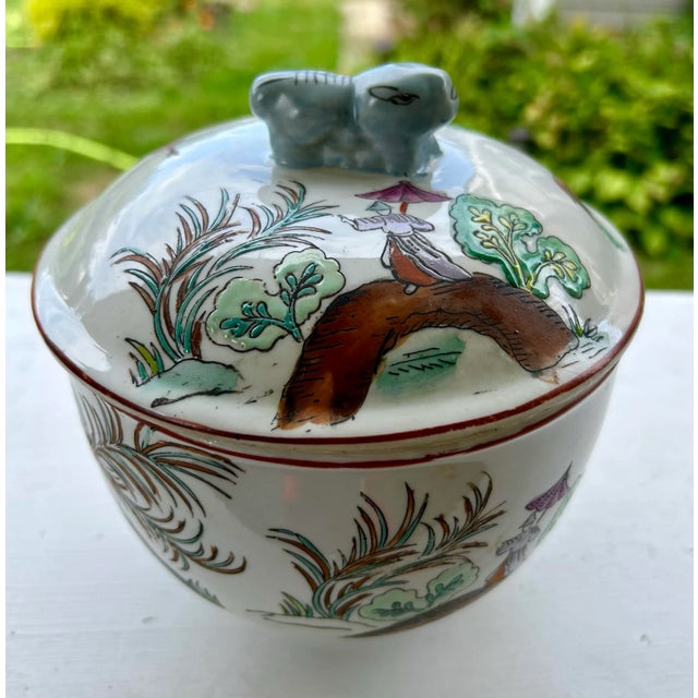 Gorgeous late 20th Century ginger jar with lid and foo dog handle. A rare design of deer adorns this very vintage Chinese...