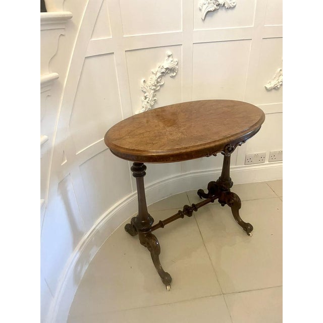 Superb quality antique Victorian inlaid burr walnut lamp table having a superb quality inlaid burr walnut oval shaped top...