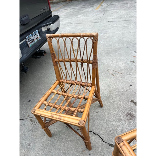 Up for consideration is a beautiful vintage pair of rattan boho chic chairs. These would look lovely in your home and they...